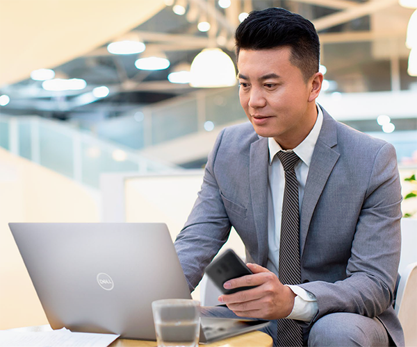 Man working on Dell laptop / Associate portrait: Dylan CH Huang