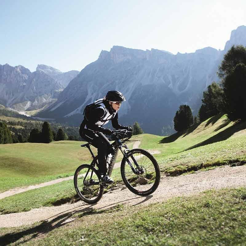 Person mountain biking uphill