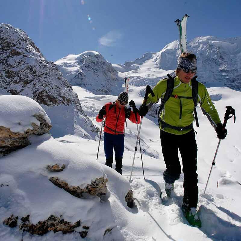 Two people hiking on a mountain